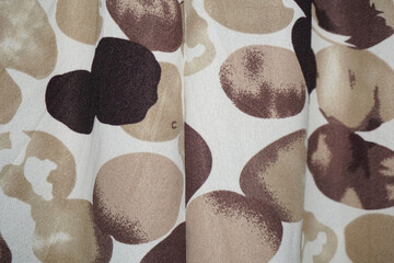 Brown polka dot pattern on white cloth