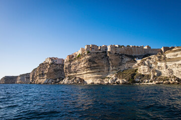 Wall Mural - View from Water to the village of Bonifacio in Corse, France, built on limestone cliffs