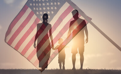 Patriotic family walking together on American flag background. American life concept. 