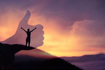 young woman out in nature with thumbs up feeling positive, and motivated. double exposure