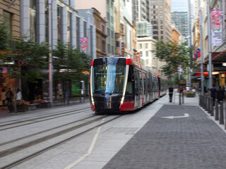 Tram moving through George St in Sydney NSW Australia