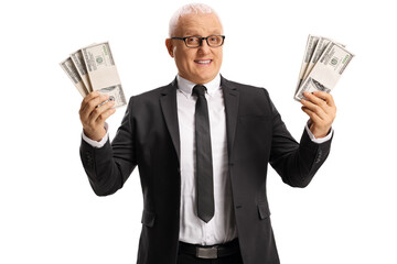 Wall Mural - Mature businessman holding stacks of us dollar banknotes