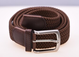 brown leather belt on a white background