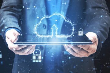 Cloud service technologies with digital cloud icon with arrow up above digital tablet in businessman hands. Double exposure