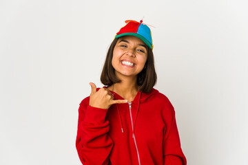 Young hispanic woman wearing a cap with propeller isolated showing a mobile phone call gesture with fingers.