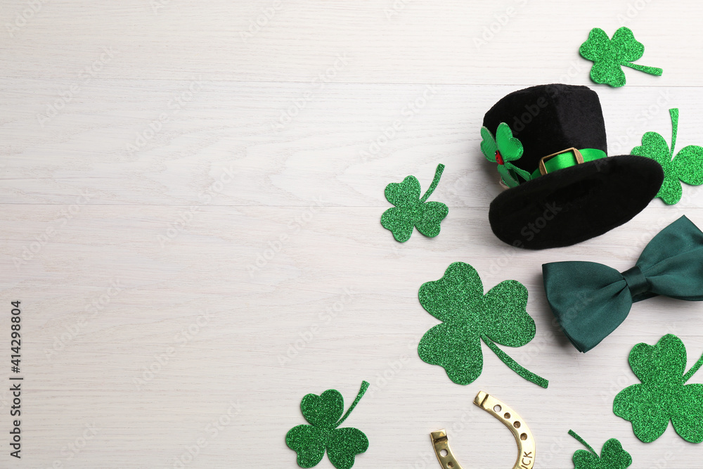 Flat lay composition with leprechaun hat on white wooden table, space for text. St Patrick's Day celebration - obrazy, fototapety, plakaty 