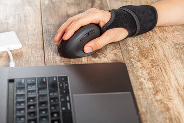 Wall Mural - chronic trauma to the wrist joint in people using computer mouse may lead to disorders that cause in