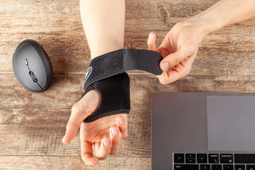 Wall Mural - chronic trauma to the wrist joint in people using computer mouse may lead to disorders that cause in
