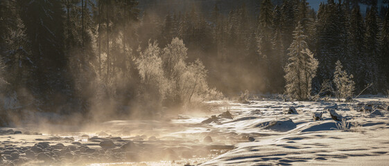 Wall Mural - winter landscape panorama - Alpine river and forest on an extremely cold winter morning