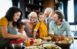 © NDABCREATIVITY - Portrait of happy family in kitchen at home