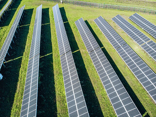 Wall Mural - Long huge solar panels top view. View from above of solar panels in the field in a row