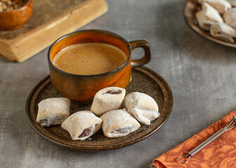 Wall Mural - Homemade vintage style jam stuffed cookies and a cup of coffee,  close up
