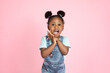 © sofiko14 - Children, emotions, gestures concept. Close up studio shot of pretty cute little African girl, scared, surprised or excited, posing to camera with her mouth open on isolated pink background