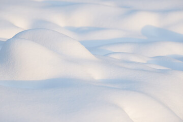 Fresh clean white snow background texture. Winter background with snowflakes and snow mounds. Snow lumps. Seasonal landscape details.