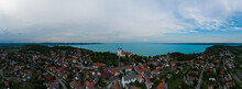 Aerial 180 Degrees Panoramic Photo About Tihany City. Lake Balaton On The Background. Famous Tourist Destination With Hungarian Monuments Church And Handmade Gifts