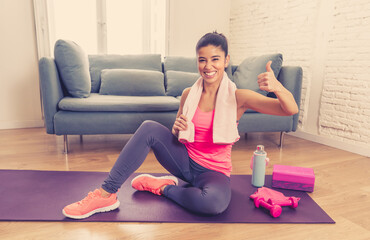 Wall Mural - Attractive woman on laptop in virtual online fitness class working out at home