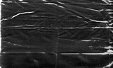 Background texture of a polyethylene,plastic transparent black plastic film,transparent stretched background