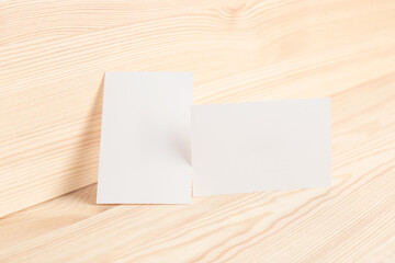 White business card template 85x55mm on natural wood texture background.  