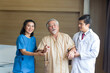 © Thirawatana - Doctors and physical therapists are caring for elderly sick people. Doctor and nurse taking care of elderly patient at hospital room.