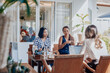 © Fxquadro - Female team of asian women sit at table together and planning their prohect using a laptop in comfortable office in daytime.