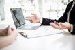 © kamiphotos - The manager is explaining information about the job position being hired to the job applicant.