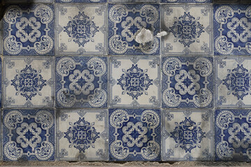 Wall Mural - Details of ancient tiles with geometrical shapes, covering facades of buildings in Lisbon. Typical sample of traditional Portuguese craft.