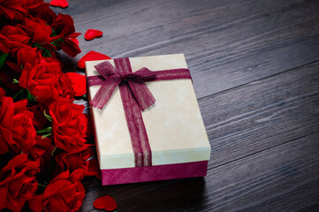 Gift box with red rose and hearts on wooden background .Valentine day concept