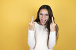 Beautiful child girl wearing casual clothes showing middle finger doing fuck you bad expression, provocation and rude attitude. screaming excited