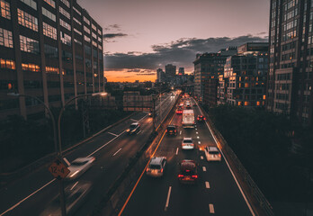 Wall Mural - traffic in the city sunset cars sky lights brooklyn new york buildings reflections 