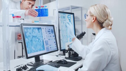 Canvas Print - Professional team of scientists is working on a vaccine in a modern scientific research laboratory. Genetic engineer workplace. Future technology and science.