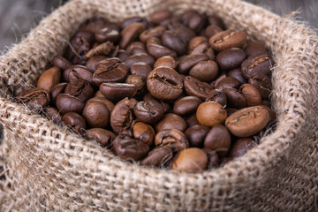 Wall Mural - Coffee beans in burlap sack. Coffee beans in burlap sack