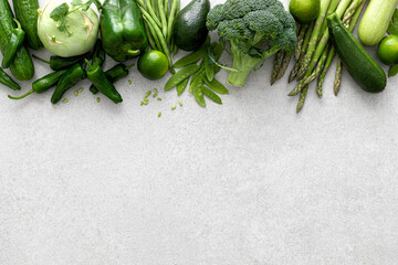 Green vegetables. Fresh green produce. Healthy vegetarian food concept background. Flat lay. Top down view