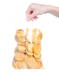 Wall Mural - Pack of cracker cookies in hand on white background isolation