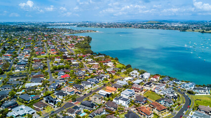 Wall Mural - Aerial view of residential houses on a shore of a beautiful. Auckland, New Zealand.