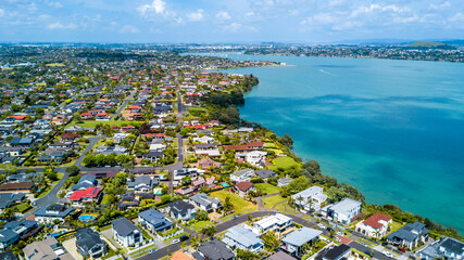 Wall Mural - Aerial view of residential houses on a shore of a beautiful. Auckland, New Zealand.