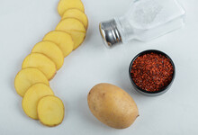 Sliced Or Hole Potato With Chili Pepper And Salt