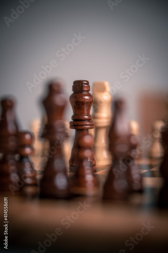 Chess pieces set up ready to play chess game on a wooden board strategy game kings head to head deadlocked