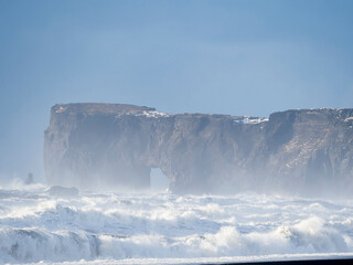 Poster - Coast near Vik y Myrdal during winter. Black volcanic beach Reynisfjara, view towards Dyrholaey, Iceland.