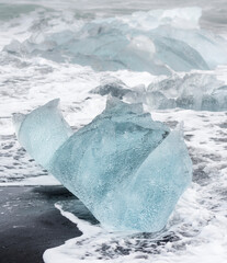 Wall Mural - Icebergs on black volcanic beach, Iceland.