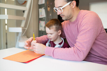 dad and son on a computer