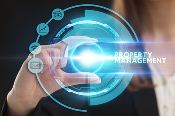 Business, Technology, Internet and network concept. Young businessman working on a virtual screen of the future and sees the inscription: Property management