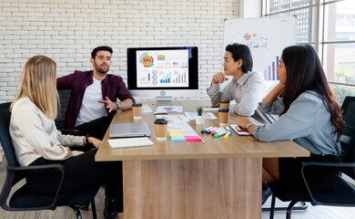 Asian and Caucasian Group of happy young business people in a meeting at office. Business meeting working together with colleagues in the modern. Concept meeting cozy smile graph.