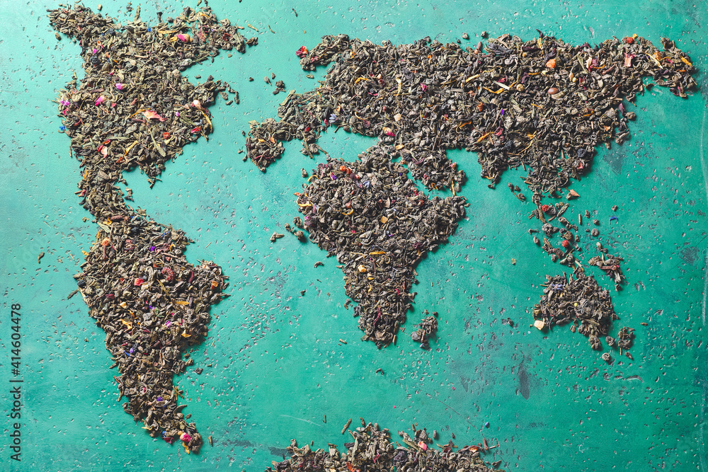 World map made of green tea on color background