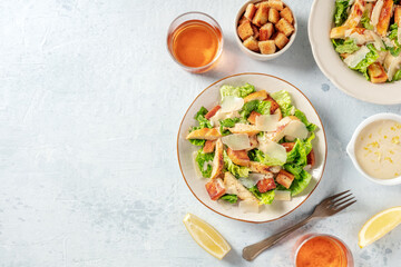 Wall Mural - Chicken Caesar salad, shot from the top with copy space