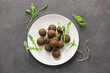 © Pixel-Shot - Plate with tasty falafel balls on dark background