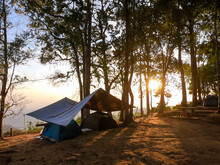 Sunrise View With Silhouette Camping Tent At Thong Pha Phum National Park Campground, Kanchanaburi, Thailand