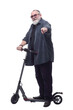 © ASDF - bearded man with an electric scooter looking at you.