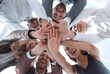 © ASDF - close up. a group of young business people showing their unity.