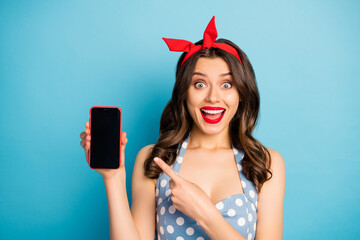 Poster - Close-up portrait of her she nice attractive lovely pretty glamorous amazed crazy cheerful cheery wavy-haired girl showing screen isolated on bright vivid shine vibrant blue color background