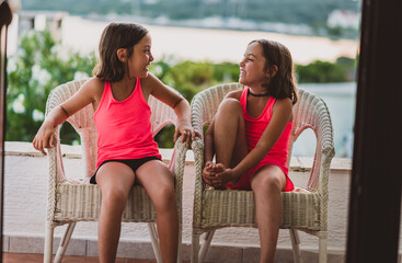 Happy girl kids enjoying summer vacation at sea resort.